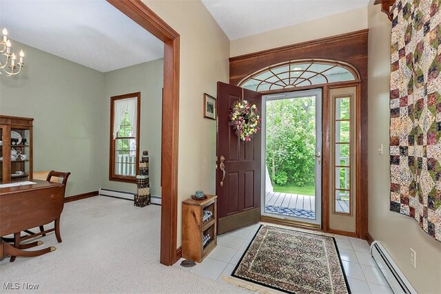 4255 River Rd, Perry, OH 44081 - foyer entrance with baseboard heating, baseboards, a chandelier, and tile patterned flooring