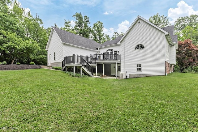 4255 River Rd, Perry, OH 44081 - rear view of property featuring stairway, a deck, a lawn, and a shingled roof