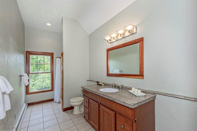 4255 River Rd, Perry, OH 44081 - full bathroom with a baseboard radiator, vanity, toilet, and tile patterned flooring