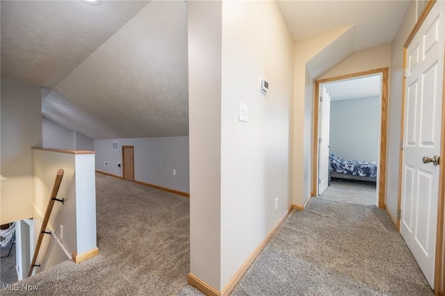 33992 Brwnsvl Co Line Rd, New Matamoras, OH 45767 - hallway with carpet flooring, an upstairs landing, baseboards, and vaulted ceiling