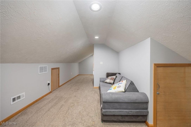 33992 Brwnsvl Co Line Rd, New Matamoras, OH 45767 - sitting room with vaulted ceiling, baseboards, carpet flooring, a textured ceiling, and recessed lighting