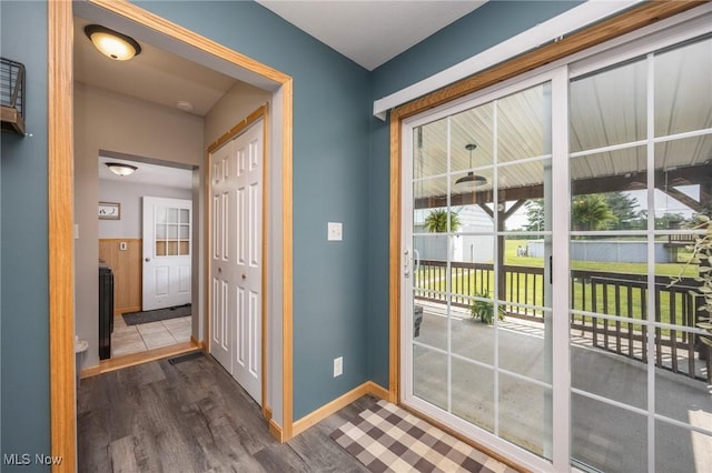 33992 Brwnsvl Co Line Rd, New Matamoras, OH 45767 - doorway to outside with dark wood finished floors and baseboards