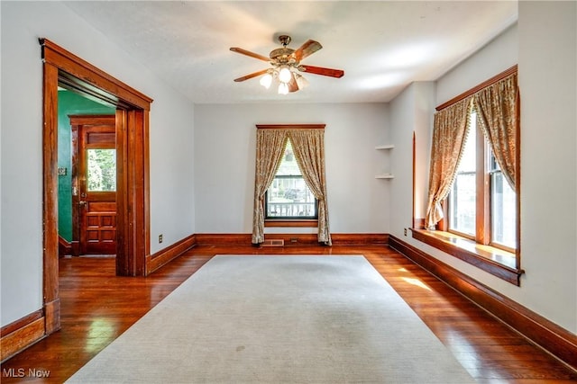 100 Byers Ave, Akron, OH 44302 - unfurnished room with wood finished floors, baseboards, and ceiling fan