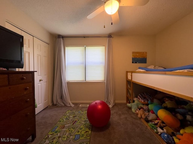 6647 Avalon St NW, Canton, OH 44708 - bedroom featuring dark carpet, a textured ceiling, and a ceiling fan