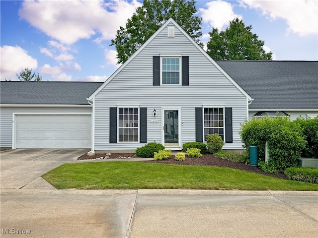 3430 E Prescott Cir, Cuyahoga Falls, OH 44223 - view of front of house with an attached garage, concrete driveway, and a front yard