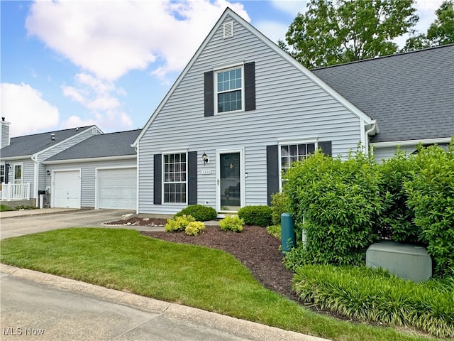 3430 E Prescott Cir, Cuyahoga Falls, OH 44223 - view of front of property with a garage, concrete driveway, and a front yard