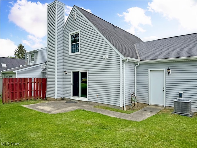 3430 E Prescott Cir, Cuyahoga Falls, OH 44223 - back of property featuring cooling unit, a patio, a chimney, and a shingled roof