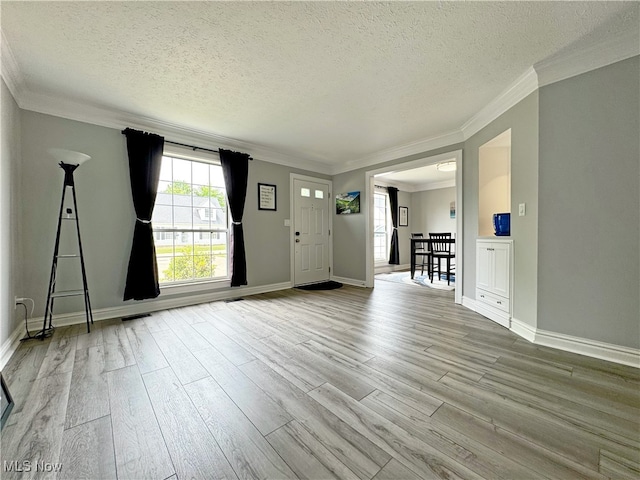 3430 E Prescott Cir, Cuyahoga Falls, OH 44223 - foyer entrance featuring wood finished floors, a textured ceiling, crown molding, and baseboards
