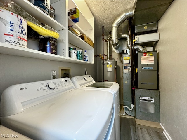 3430 E Prescott Cir, Cuyahoga Falls, OH 44223 - washroom featuring separate washer and dryer, wood finished floors, water heater, and baseboards