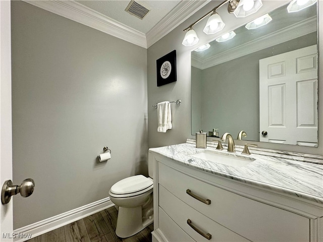 3430 E Prescott Cir, Cuyahoga Falls, OH 44223 - bathroom with toilet, vanity, wood finished floors, baseboards, and crown molding