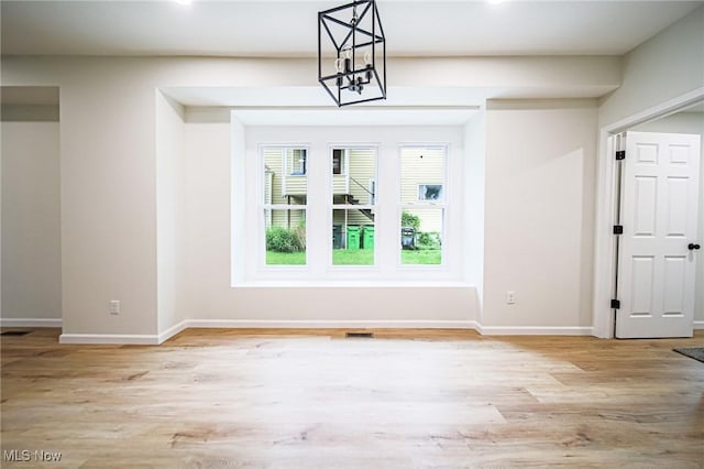 433 N Buckeye, Wooster, OH 44691 - unfurnished dining area featuring wood finished floors, baseboards, a chandelier, and recessed lighting