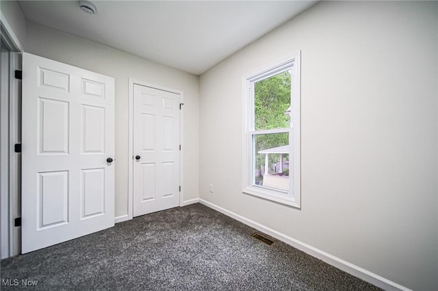 433 N Buckeye, Wooster, OH 44691 - unfurnished bedroom with dark carpet and baseboards