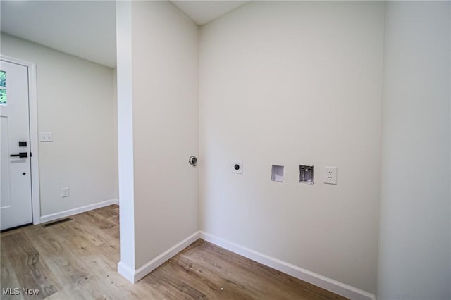 433 N Buckeye, Wooster, OH 44691 - laundry area with electric dryer hookup, light wood-style flooring, hookup for a washing machine, and baseboards