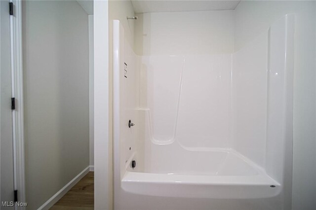 433 N Buckeye, Wooster, OH 44691 - full bathroom with baseboards, tub / shower combination, and wood finished floors