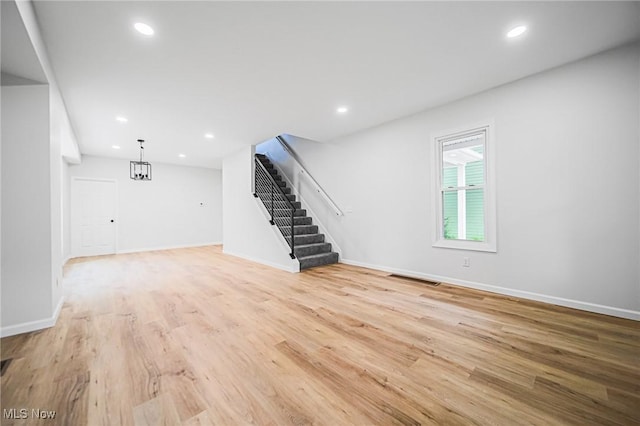 433 N Buckeye, Wooster, OH 44691 - unfurnished living room featuring stairway, light wood-style flooring, baseboards, and recessed lighting