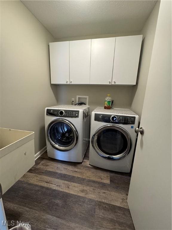 1470 Butterfield Cir, Niles, OH 44446 - washroom featuring washer and dryer, cabinet space, dark wood-type flooring, and baseboards