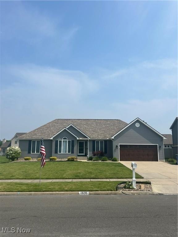 1470 Butterfield Cir, Niles, OH 44446 - single story home with a front lawn, concrete driveway, and an attached garage