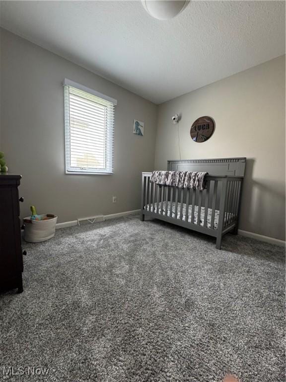 1470 Butterfield Cir, Niles, OH 44446 - bedroom featuring carpet floors, baseboards, a nursery area, and a textured ceiling