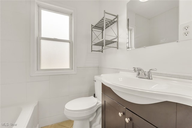 5002 Lincoln Ave, Parma, OH 44134 - full bathroom featuring vanity, tile walls, healthy amount of natural light, toilet, and a tub to relax in