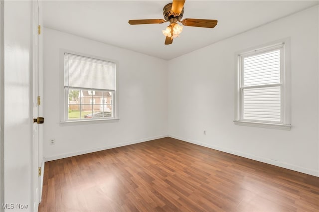 5002 Lincoln Ave, Parma, OH 44134 - empty room with wood finished floors, baseboards, and a ceiling fan