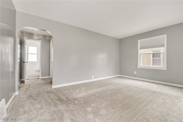 5002 Lincoln Ave, Parma, OH 44134 - carpeted empty room with arched walkways and baseboards