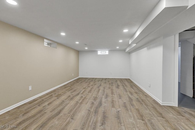 14148 Rochelle Dr, Maple Heights, OH 44137 - basement with recessed lighting, wood finished floors, and baseboards