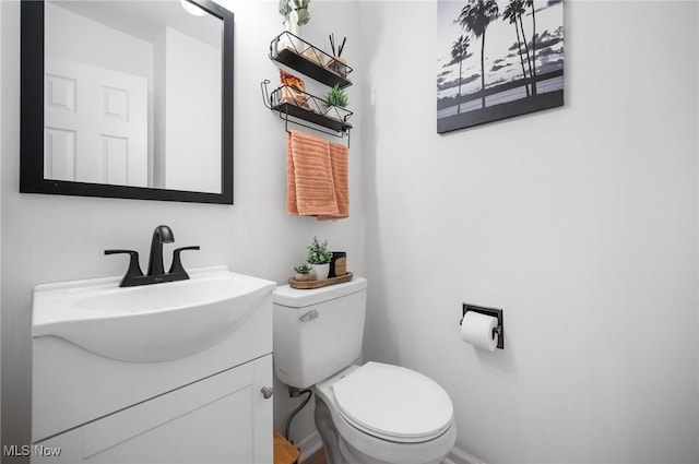 8222 Starburst Rd, Mentor, OH 44060 - bathroom with vanity, toilet, and baseboards