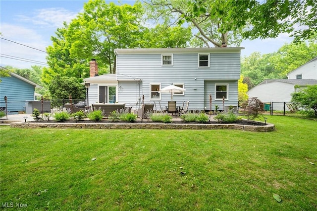8222 Starburst Rd, Mentor, OH 44060 - rear view of house featuring a chimney, a patio, and outdoor lounge area