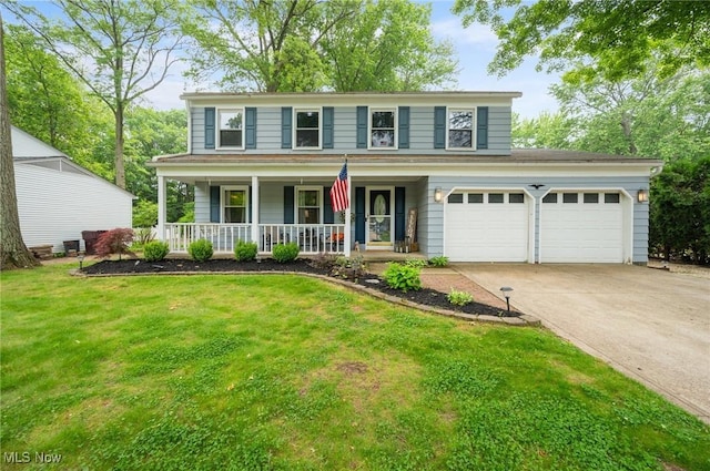 8222 Starburst Rd, Mentor, OH 44060 - view of front of property with a porch, concrete driveway, a front yard, and an attached garage
