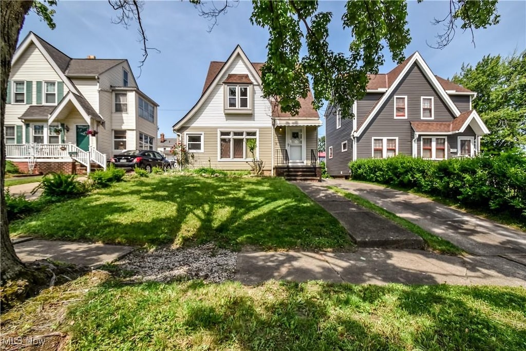 4420 W 60th St, Cleveland, OH 44144 - view of front facade with a front lawn