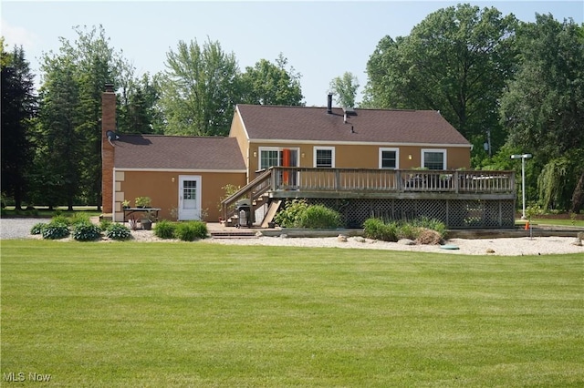 6019 New London Rd, Ashtabula, OH 44004 - back of house with a wooden deck and a lawn