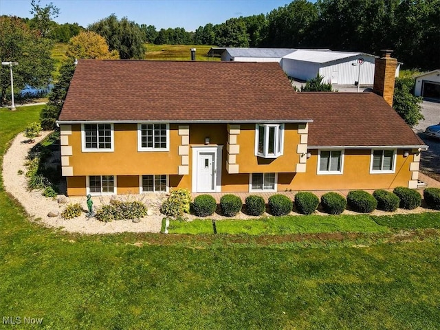 6019 New London Rd, Ashtabula, OH 44004 - view of front of house with stucco siding and a front lawn