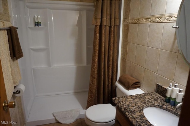 6019 New London Rd, Ashtabula, OH 44004 - bathroom with a stall shower, toilet, vanity, backsplash, and tile walls