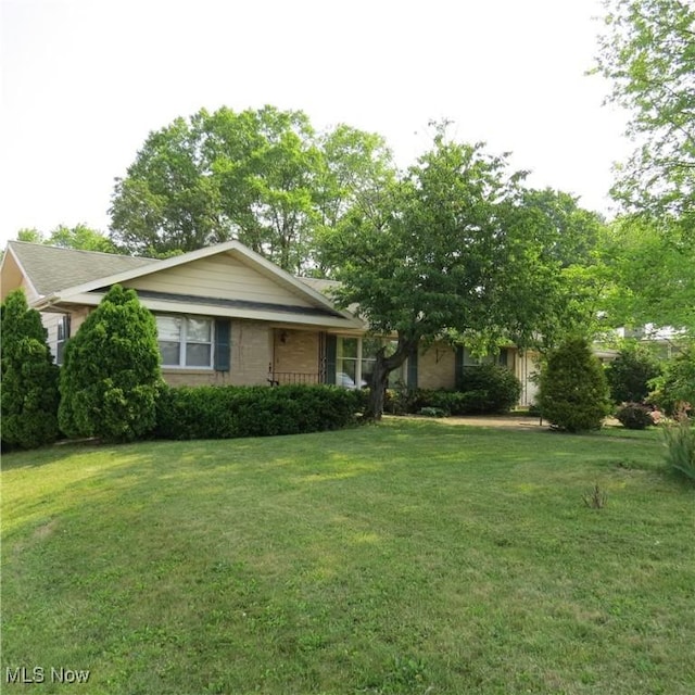 576 12th St NW, Carrollton, OH 44615 - view of front of house featuring a front lawn