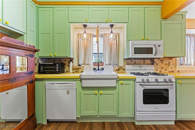 97 Overlook Blvd, Struthers, OH 44471 - kitchen featuring white appliances, green cabinetry, a sink, decorative backsplash, and light countertops