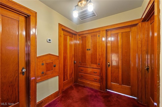 97 Overlook Blvd, Struthers, OH 44471 - hall featuring wainscoting, dark carpet, and wood walls