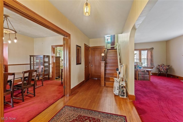 97 Overlook Blvd, Struthers, OH 44471 - entryway with baseboards, stairway, wood finished floors, and arched walkways