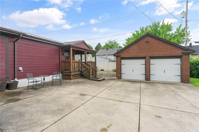 97 Overlook Blvd, Struthers, OH 44471 - view of side of property with a detached garage, brick siding, and an outbuilding