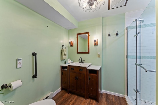 97 Overlook Blvd, Struthers, OH 44471 - bathroom with vanity, a shower stall, wood finished floors, and toilet