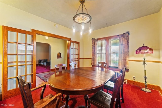 97 Overlook Blvd, Struthers, OH 44471 - dining room with arched walkways, baseboards, and french doors