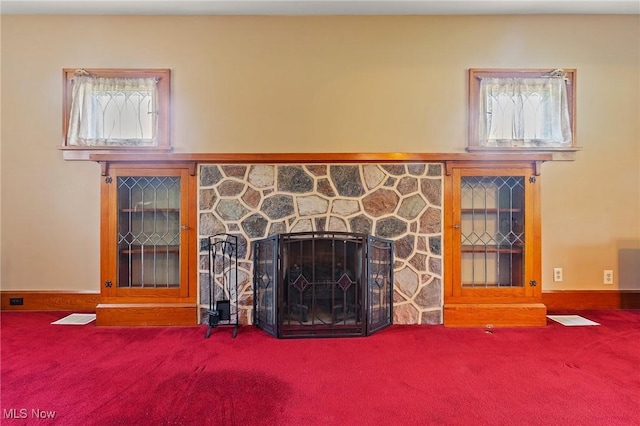 97 Overlook Blvd, Struthers, OH 44471 - unfurnished living room with carpet floors, a fireplace, and plenty of natural light
