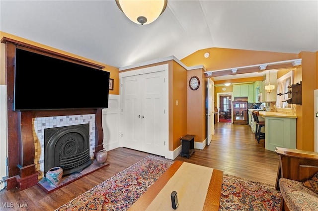 97 Overlook Blvd, Struthers, OH 44471 - living room with vaulted ceiling, wood finished floors, and a fireplace