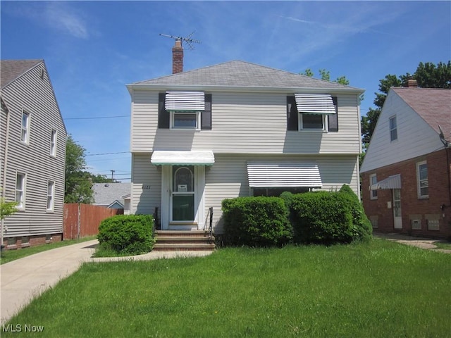 4121 W 57th St, Cleveland, OH 44144 - view of front of house with a chimney and entry steps