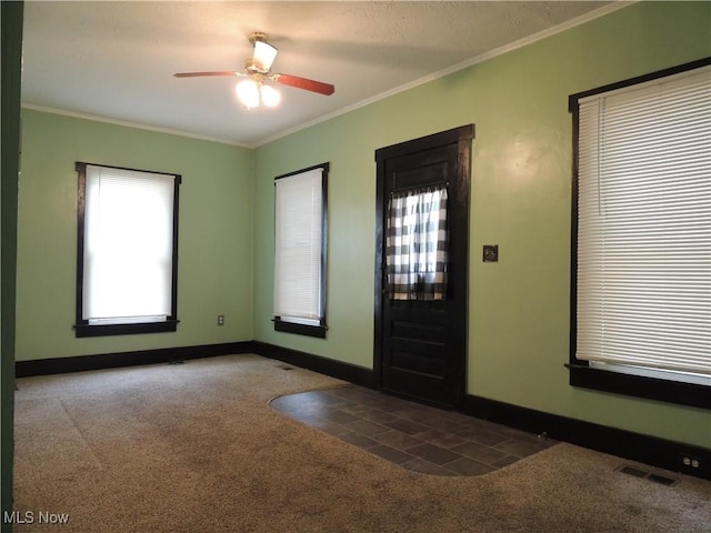 2242 Coffeen St, Kent, OH 44240 - entrance foyer with carpet, ornamental molding, baseboards, and a ceiling fan