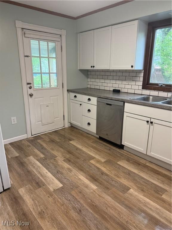 533 W Park Ave, Niles, OH 44446 - kitchen featuring dishwasher, white cabinetry, dark countertops, dark wood-style floors, and ornamental molding