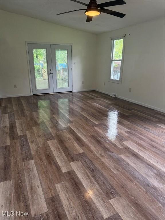 533 W Park Ave, Niles, OH 44446 - unfurnished room with french doors, ceiling fan, wood finished floors, and baseboards