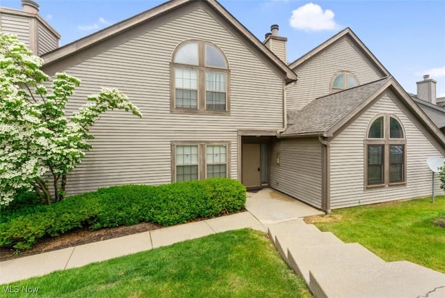4044 Saint Andrews Ct, Canfield, OH 44406 - view of front of property with a chimney and a front yard