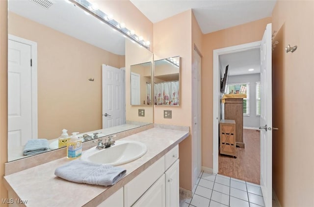 4044 Saint Andrews Ct, Canfield, OH 44406 - full bath with vanity, tile patterned floors, and baseboards