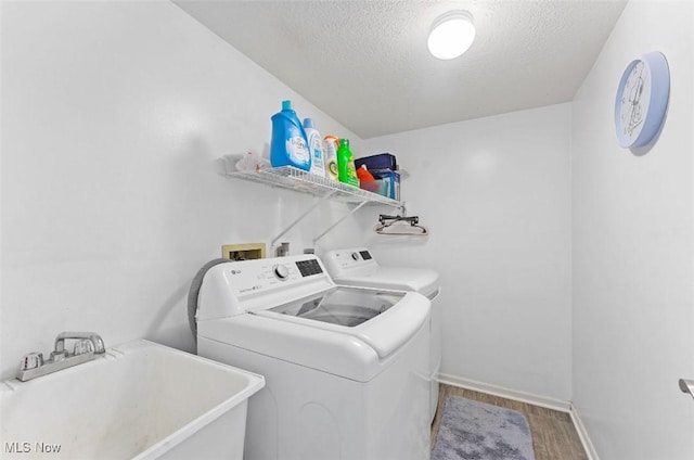 4044 Saint Andrews Ct, Canfield, OH 44406 - washroom with washer and dryer, a textured ceiling, wood finished floors, and baseboards