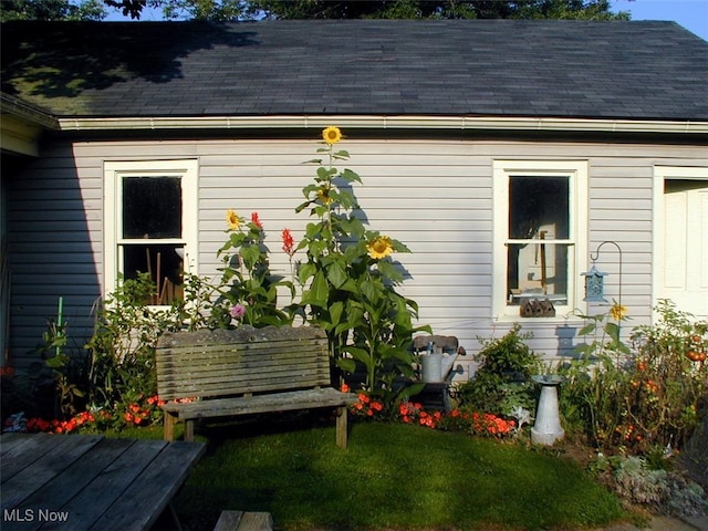 518 Hill St, Coshocton, OH 43812 - view of side of home featuring roof with shingles